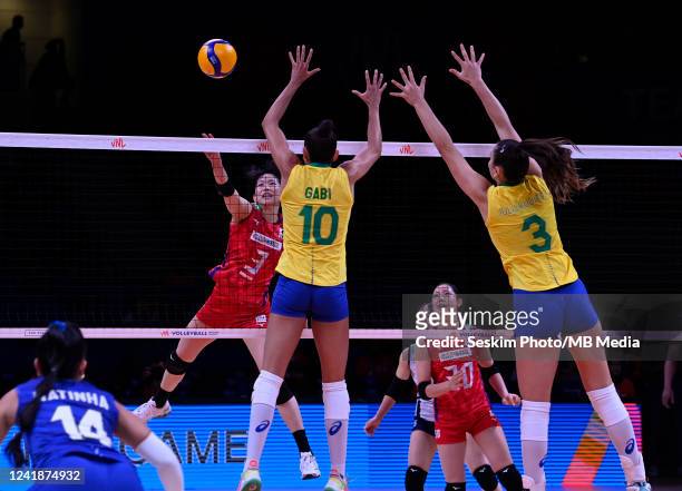 Julia Gambatto Kudiess , Gabriela Braga Guimaraes of Brazil and Sarina Koga of Japan during the Womens Volleyball Nations League Quarter Final match...