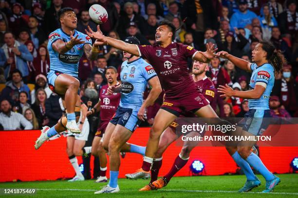 New South Wales' Brian To'o and Queenland's Jeremiah Nanai contest a high ball during the State of Origin rugby league match between Queensland and...