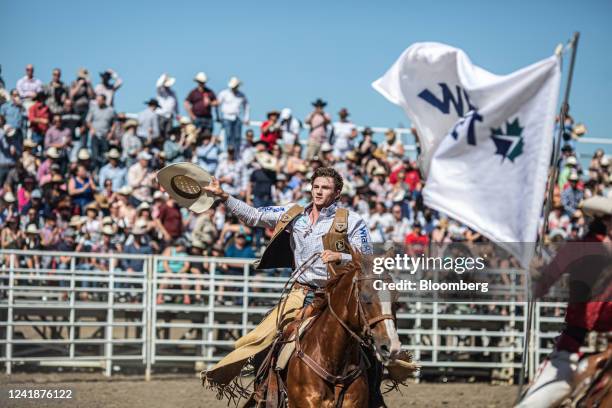 Competitor Creek Young takes a victory lap after winning a bull riding event during the rodeo at the Calgary Stampede in Calgary, Alberta, Canada, on...