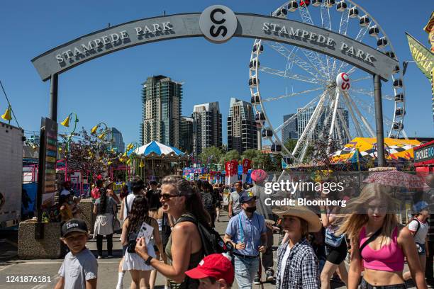 Attendees at the Calgary Stampede in Calgary, Alberta, Canada, on Tuesday, July 12, 2022. The biggest party in Canada's oil patch is staging a...