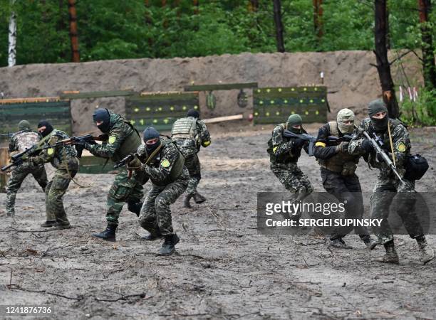 Fighters of the territorial defence unit, a support force to the regular Ukrainian army, take part in an exercise as part of the regular combat...