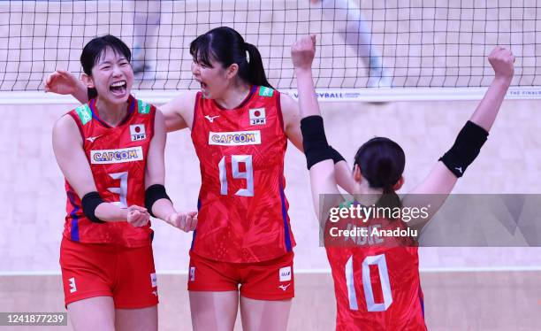 Players of Japan celebrate after a score during FIVB Women's Volleyball Nations League Final Phase quarterfinal match between Brazil and Japan at...