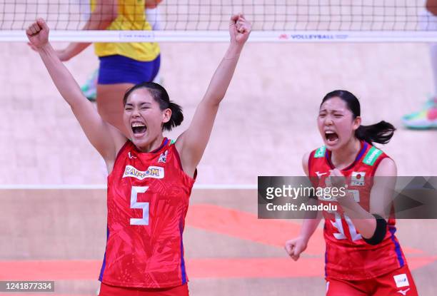 Players of Japan celebrate after a score during FIVB Women's Volleyball Nations League Final Phase quarterfinal match between Brazil and Japan at...