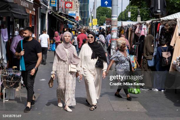 Street scene at Whitechapel Market on Whitechapel High Street on 13th July 2022 in London, United Kingdom. Whitechapel is an ethnically diverse and...