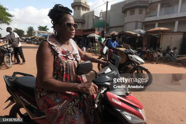 People ride motorcycles as daily life continues in Ouagadougou, Burkina Faso on July 12, 2022. Burkina Faso, where approximately 20 million people...