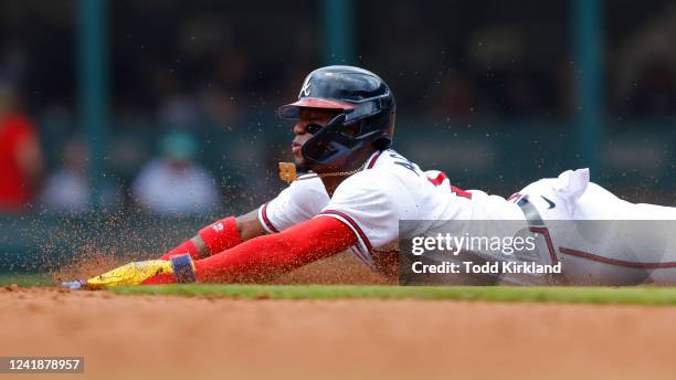 Ronald Acuna Jr. #13 of the Atlanta Braves steals second base during the third inning against the New York Mets at Truist Park on July 13, 2022 in...