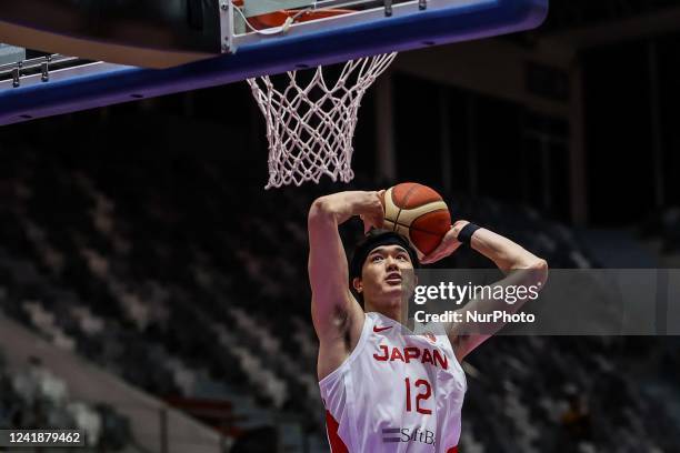 Yuta Watanabe of Japan dunks against Kazakhstan during their group stage match at the FIBA Asia Cup basketball tournament in Jakarta, Indonesia,...