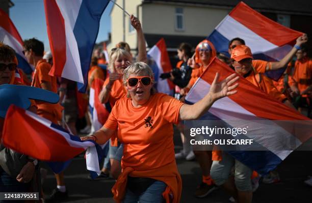 Netherland's fans wave the national flag and chant as they arrive to attend the UEFA Women's Euro 2022 Group C football match between Netherlands and...