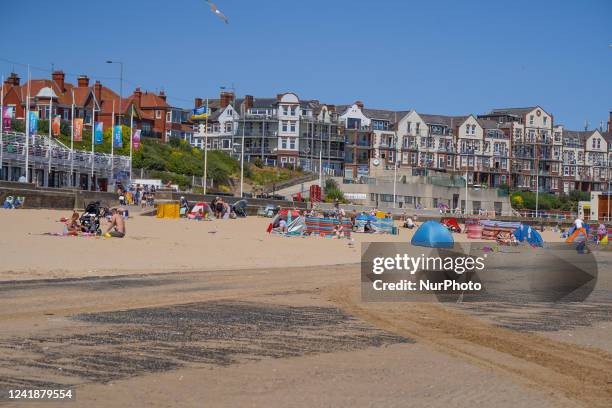 Members of the public enjoy the warm weather on Bridlington Beach on 13 July 2022.