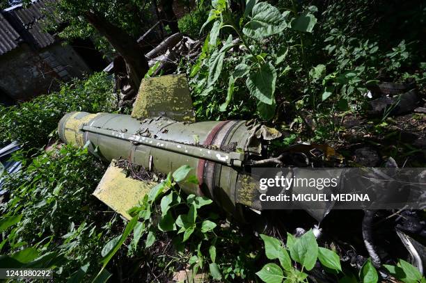 Picture taken on July 13 shows a Soviet tactical ballistic missile Tochka U in the garden of a house in eastern Ukraine, amid the Russian invasion of...