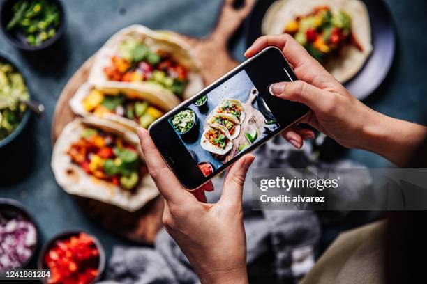 hands of cook photographing mexican tacos - cooked mushrooms stock pictures, royalty-free photos & images