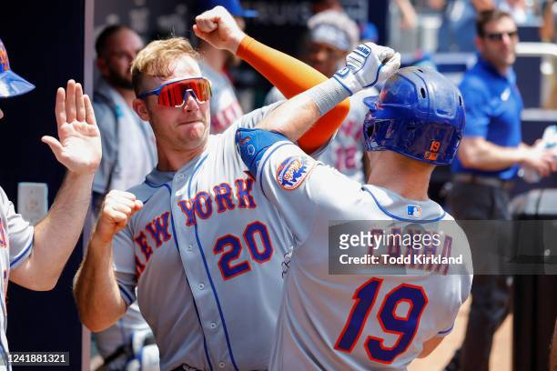 Mark Canha reacts with Pete Alonso of the New York Mets after his home run during the sixth inning against the Atlanta Braves at Truist Park on July...