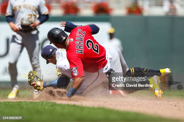 Luis Arraez of the Minnesota Twins is tagged out at second base on a fielder's choice by Kolten Wong of the Milwaukee Brewers in the seventh inning...