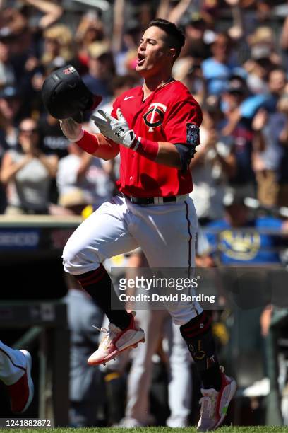 Jose Miranda of the Minnesota Twins celebrates his three-run walk off home run as he rounds the bases against the Milwaukee Brewers in the ninth...