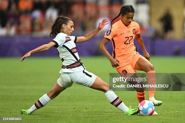 Portugal's defender Catarina Amado vies with Netherlands' striker Esmee Brugts during the UEFA Women's Euro 2022 Group C football match between...