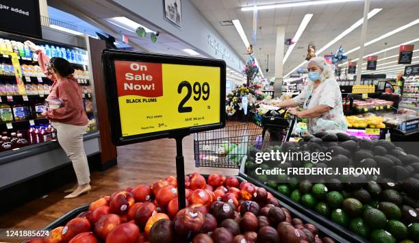 People shop at a grocery supermarket in Alhambra, California, on July 13, 2022. US consumer price inflation surged 9.1 percent over the past 12...