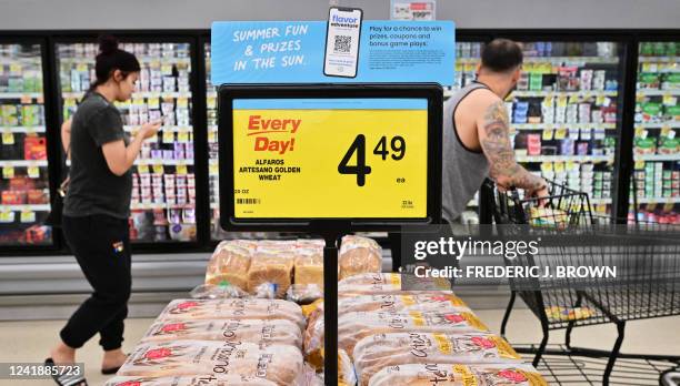 People shop at a grocery supermarket in Alhambra, California, on July 13, 2022. US consumer price inflation surged 9.1 percent over the past 12...