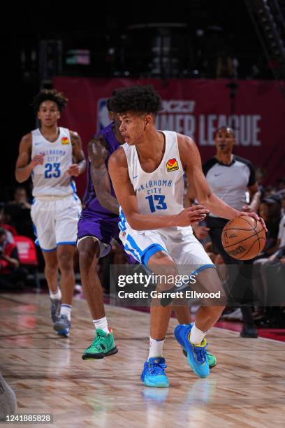 Ousmane Dieng of the Oklahoma City Thunder dribbles the ball during the game against the Sacramento Kings during the 2022 Las Vegas Summer League on...