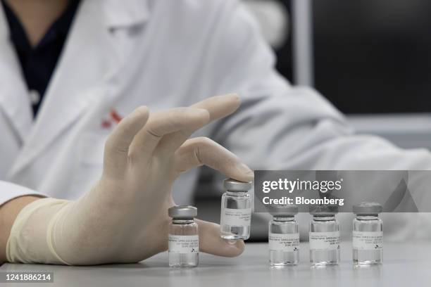 An employee holds a vial of SKYCovione Covid-19 vaccine in the SK Bioscience Co.'s R&D Center in Seongnam, South Korea, on Wednesday, July 13, 2022....