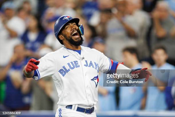 Teoscar Hernandez of the Toronto Blue Jays celebrates his two-run home run in the eighth inning against the Philadelphia Phillies at Rogers Centre on...