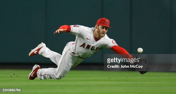 Taylor Ward of the Los Angeles Angels comes up short on this ball off the bat of Martin Maldonado of the Houston Astros for a double in the fifth...