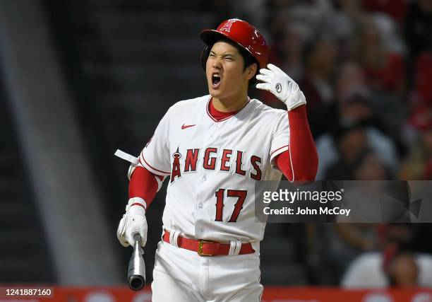Shohei Ohtani of the Los Angeles Angels reacts to hitting a foul ball while playing the Houston Astros at Angel Stadium of Anaheim on July 13, 2022...
