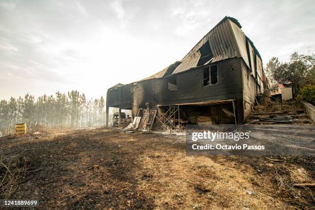 This photograph shows a burnt house and a carpentry company at Ansiao on July 14, 2022 in Pombal, Portugal. Wildfires have swept across the central...