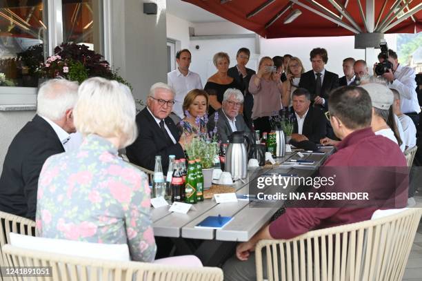 German President Frank-Walter Steinmeier and Rhineland-Palatinate's State Premier Malu Dreyer are pictured during a visit at the rebuilt wine tavern...