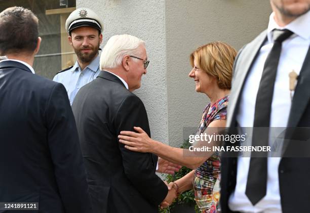 German President Frank-Walter Steinmeier shakes hands with Rhineland-Palatinate's State Premier Malu Dreyer during their visit at the rebuilt wine...