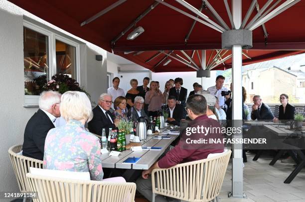 German President Frank-Walter Steinmeier and Rhineland-Palatinate's State Premier Malu Dreyer are pictured during a visit at the rebuilt wine tavern...