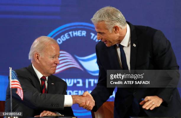 President Joe Biden and Israel's caretaker Prime Minister Yair Lapid, shake hands before signing a security pledge in Jerusalem, on July 14, 2022.