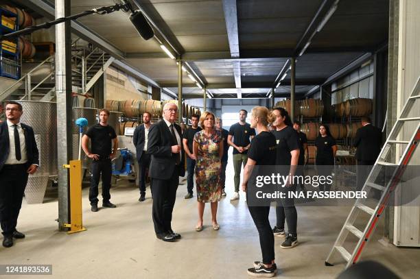 German President Frank-Walter Steinmeier and Rhineland-Palatinate's State Premier Malu Dreyer listen to the winegrower during their visit to the...