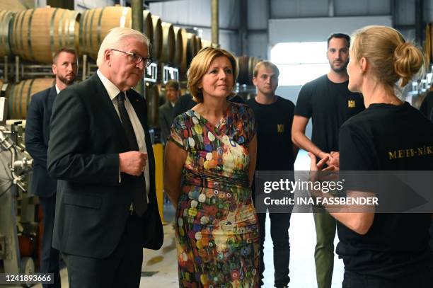 German President Frank-Walter Steinmeier and Rhineland-Palatinate's State Premier Malu Dreyer listen to the winegrower during their visit to the...