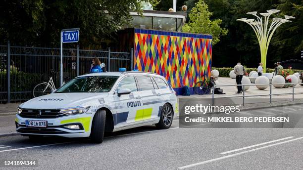 Police car is seen outside the closed Tivoli Friheden amusement park, in Aarhus, western Denmark, after a 14-year-old girl was killed and a...