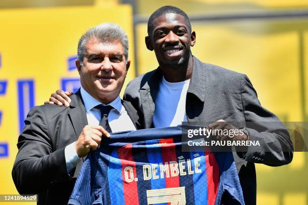 Barcelona's French forward Ousmane Dembele and FC Barcelona's President Joan Laporta pose during Ousmane Dembele's ceremony at the Joan Gamper...