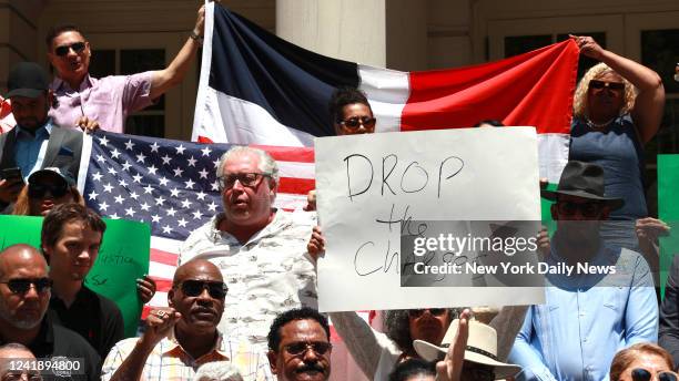 July 13: Members of the Dominican Republic Community, Bodega owners and different associations are pictured on the steps of City Hall during press...