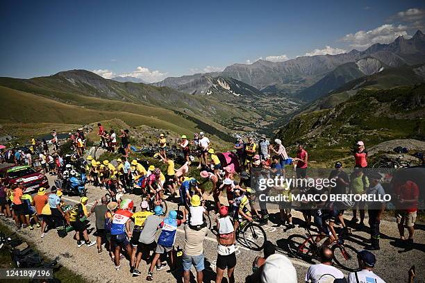 Breakaway riders cycle in the ascent of Alpe d'Huez during the 12th stage of the 109th edition of the Tour de France cycling race 1 km between...