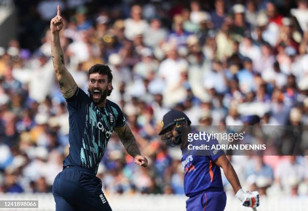England's Reece Topley celebrates a wicket during the Second Royal London One Day International cricket match between England and India at the Lord's...