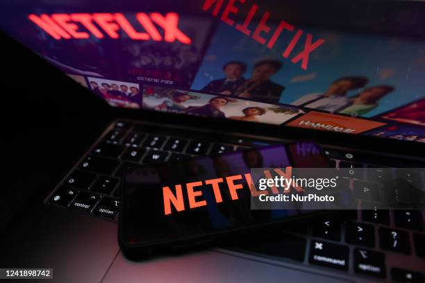 Netflix logo displayed on a phone screen and Netflix website displayed on a laptop screen are seen in this illustration photo taken in Krakow, Poland...