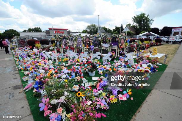 Memorial Garden" filled with flowers, photos and mementos sits outside the Tops Friendly Market on Jefferson Avenue on July 14, 2022 in Buffalo, New...