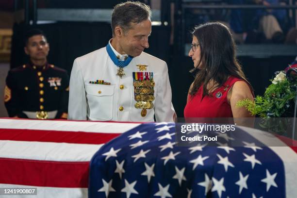 Britt Slabinski, left, a retired U.S. Navy SEAL and recipient of the Medal of Honor, pays his tribute at a Lying in Honor event held for Chief...