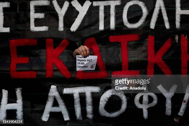 Banner is seen as demonstrators stage a protest against governmental practices in front of Greek Parliament in Athens, Greece on July 14, 2022.