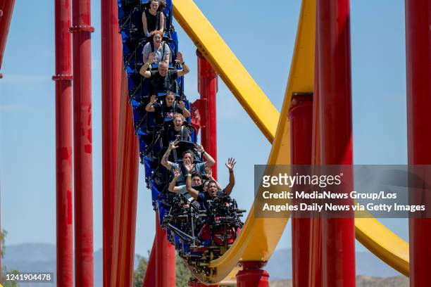 Valencia, CA People ride the new Wonder Woman Flight of Courage roller coaster during a press preview of the coaster at Six Flags Magic Mountain in...