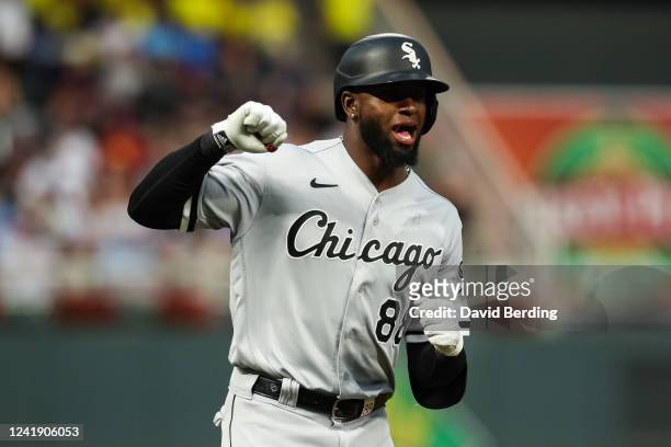 Luis Robert of the Chicago White Sox celebrates his grand slam on the base paths against the Minnesota Twins in the fourth inning at Target Field on...