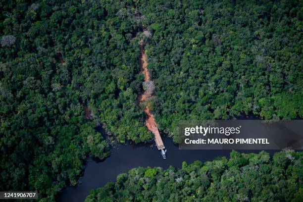 Aerial view showing an illegal dock by a river to remove wood from the Amazon rainforest seen during a flight between Manaus and Manicore, in...