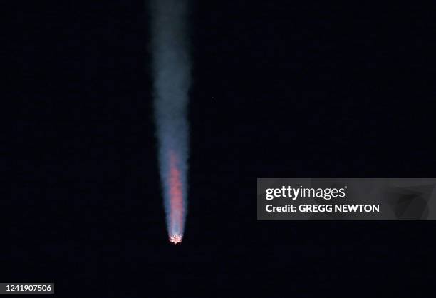 SpaceX Falcon 9 rocket streaks toward space on the CRS-25 mission after lifting off from pad LC-39A at the Kennedy Space Center in Florida on July...