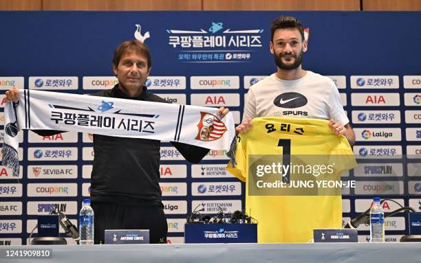 Tottenham Hotspur's head coach Antonio Conte and goalkeeper Hugo Lloris pose during a press conference in Seoul on July 15 ahead of the pre-season...