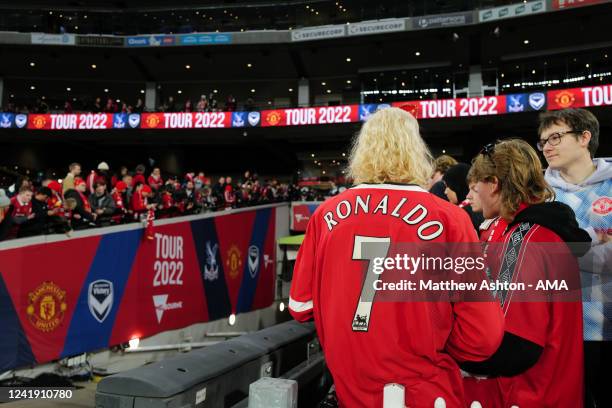 Fan of Manchester United wearing a Cristiano Ronaldo of Manchester United shirt, of who is not playing awaits the players ahead of the Pre-Season...