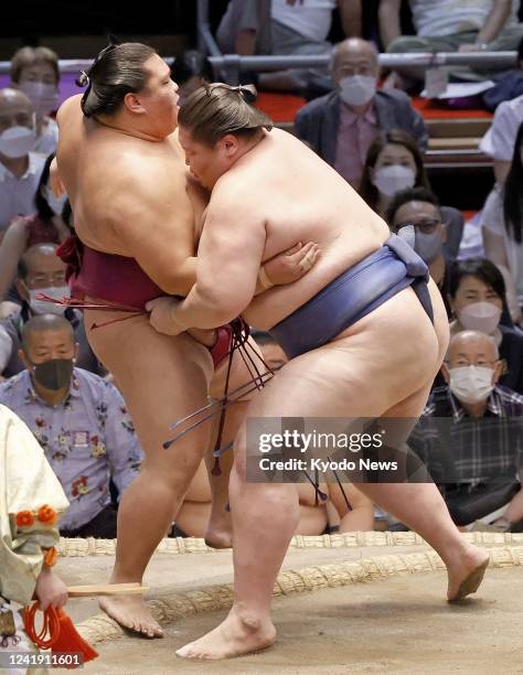 Ichinojo defeats ozeki Mitakeumi on the sixth day of the 15-day Nagoya Grand Sumo Tournament at Dolphins Arena in Nagoya, central Japan, on July 15,...