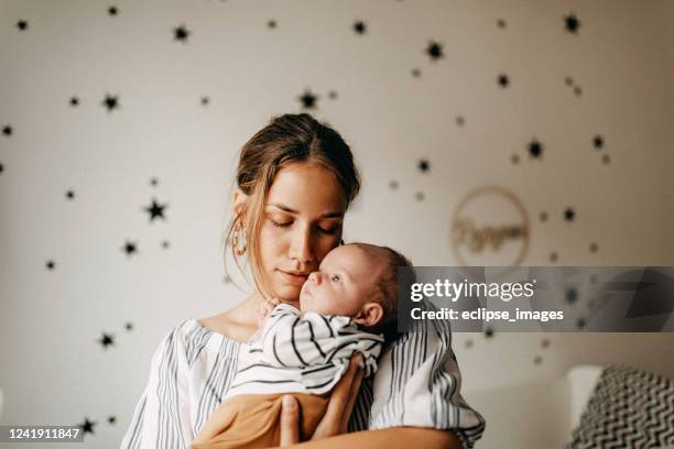 mom's boy - kissing feet stock pictures, royalty-free photos & images